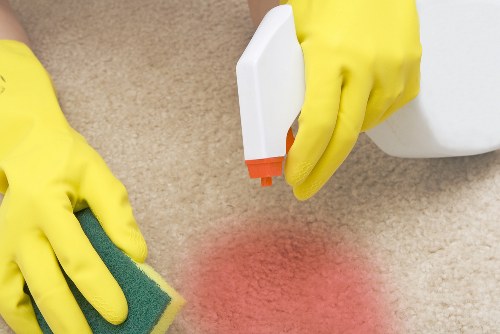 Professional upholstery cleaning for a fabric sofa in N10