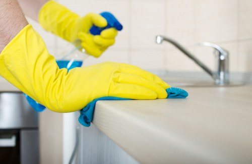 Local cleaner preparing to clean a hallway and living space in an N10 property