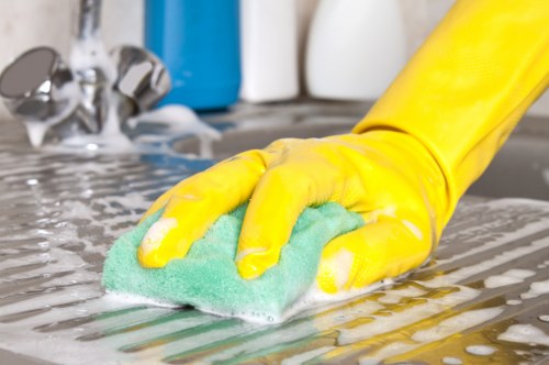Local technician cleaning a sofa in a N10 home